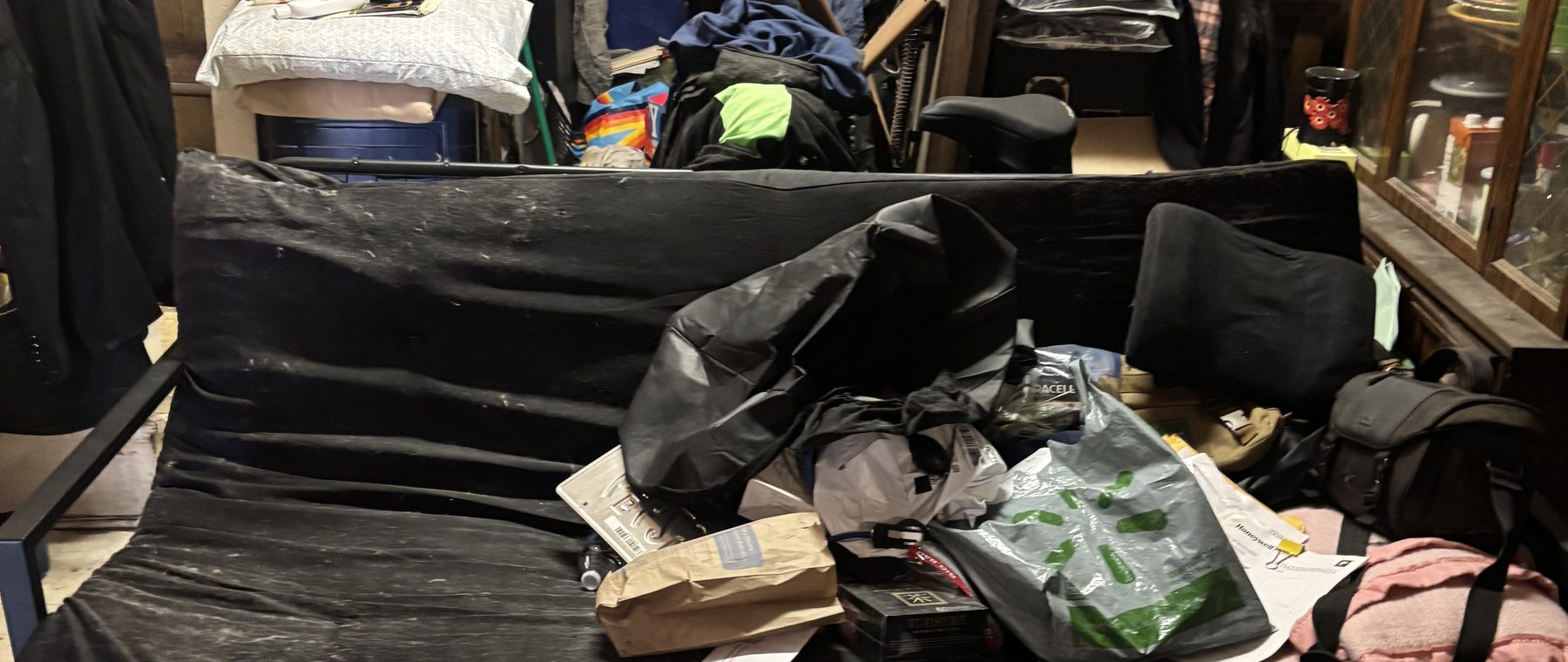 A room packed floor to ceiling with belongings before a cleanout